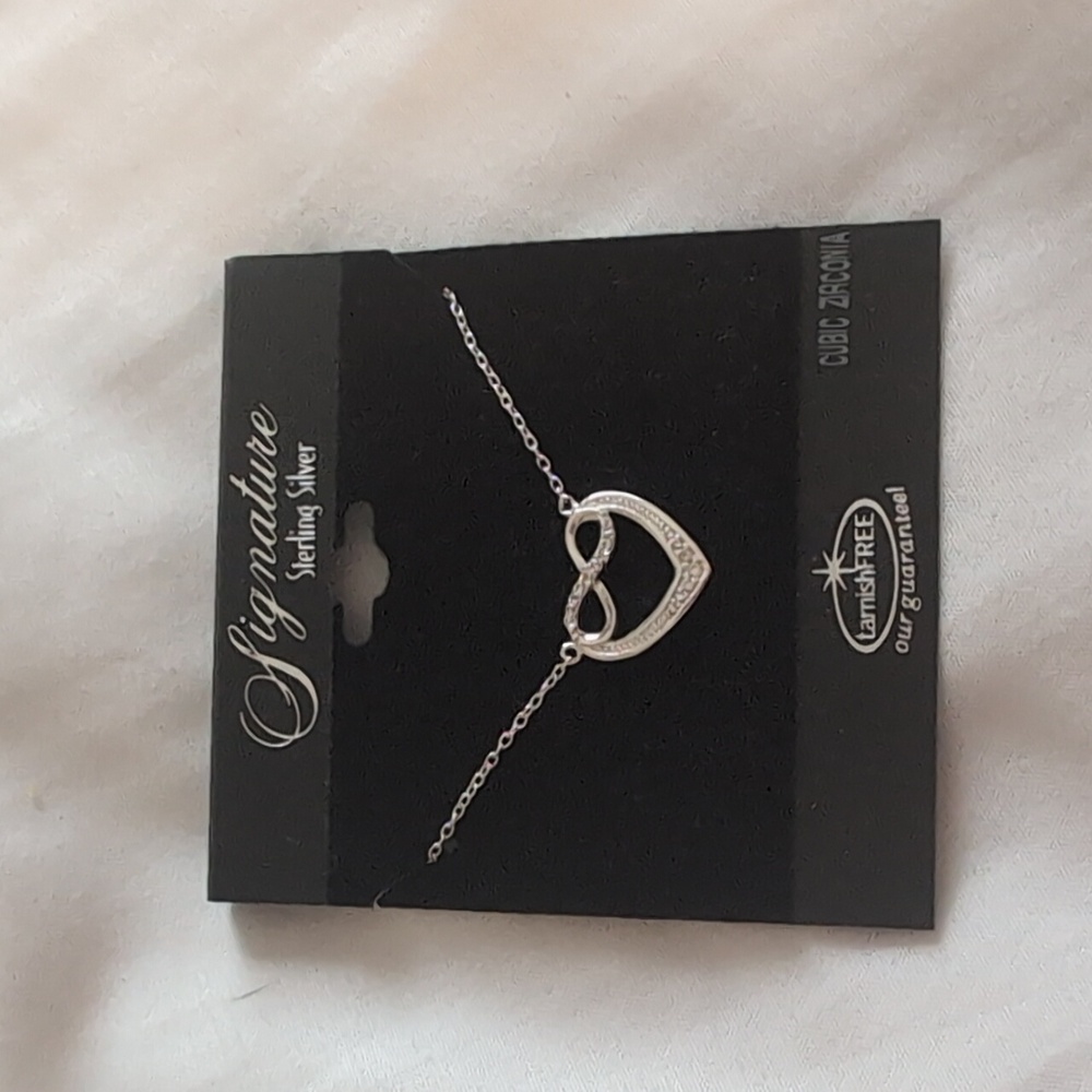 Signature sterling silver  cubic zirconia heart necklace. Brand new.